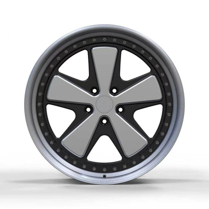 Superior Forged Porsche FUCH Style Comp multi-piece wheel, front view with silver spokes, black recesses, and exposed assembly hardware